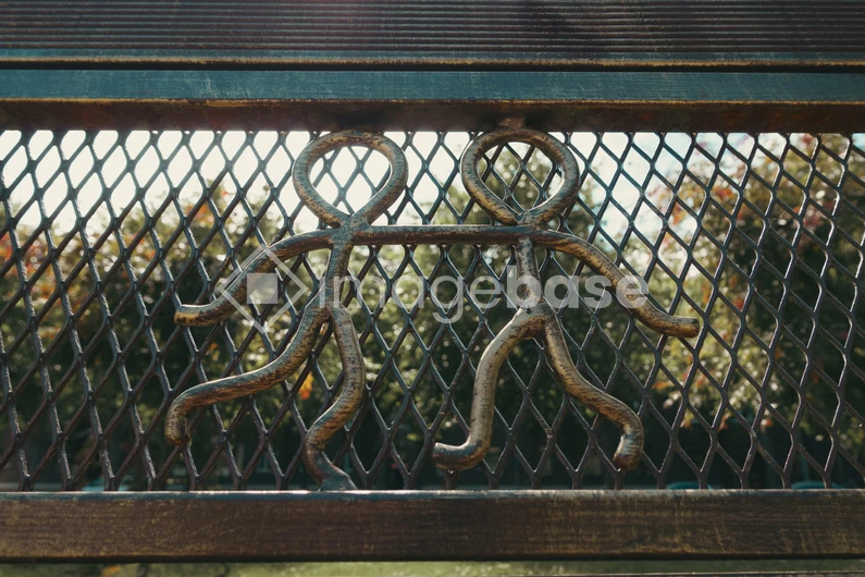 Metal Figures on Fence