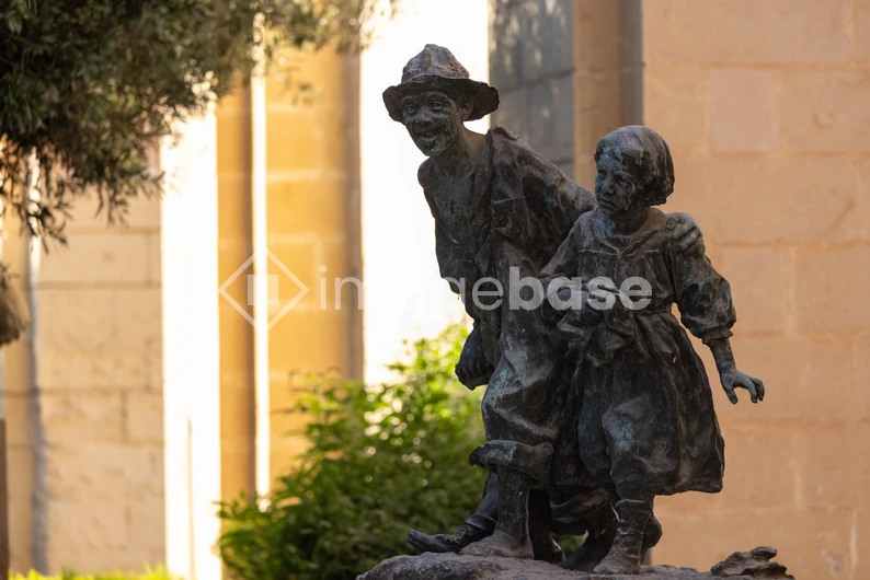 Charming Bronze Statue in Sunlit Setting