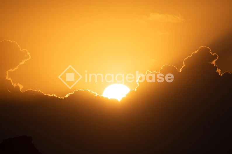 Sunset Behind Clouds
