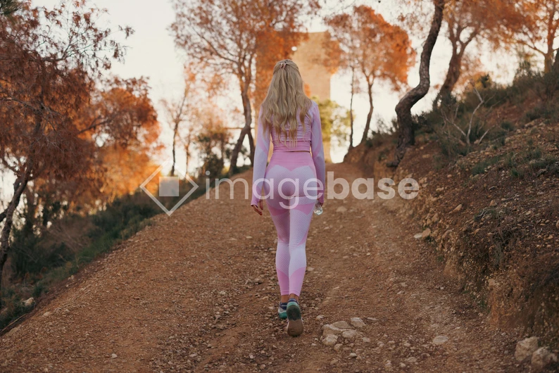 Woman Hiking in Autumn Landscape