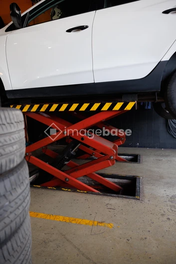 Car on Lift in Workshop