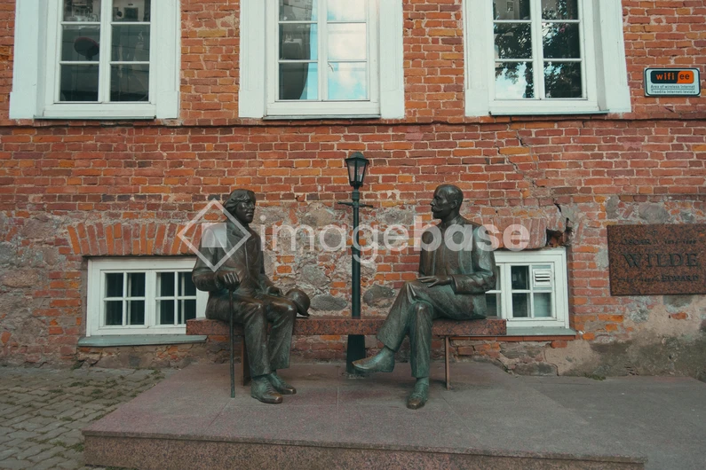 Bronze Sculptures on a Brick Wall