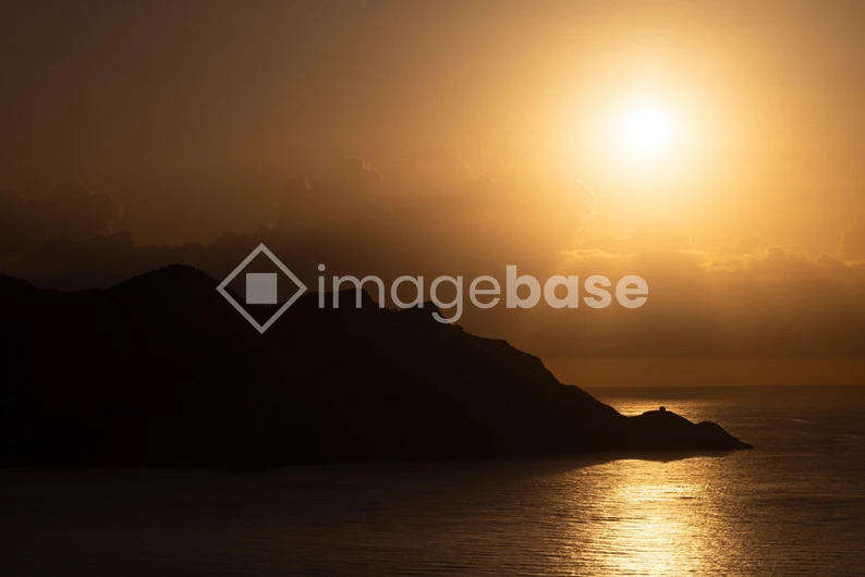 Sunset Over Mountain Silhouette