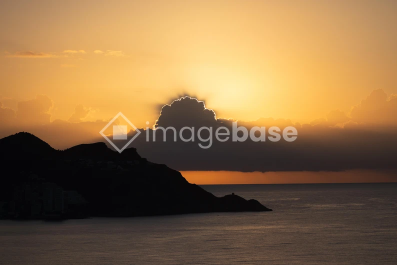 Sunset Over Mountain Silhouette