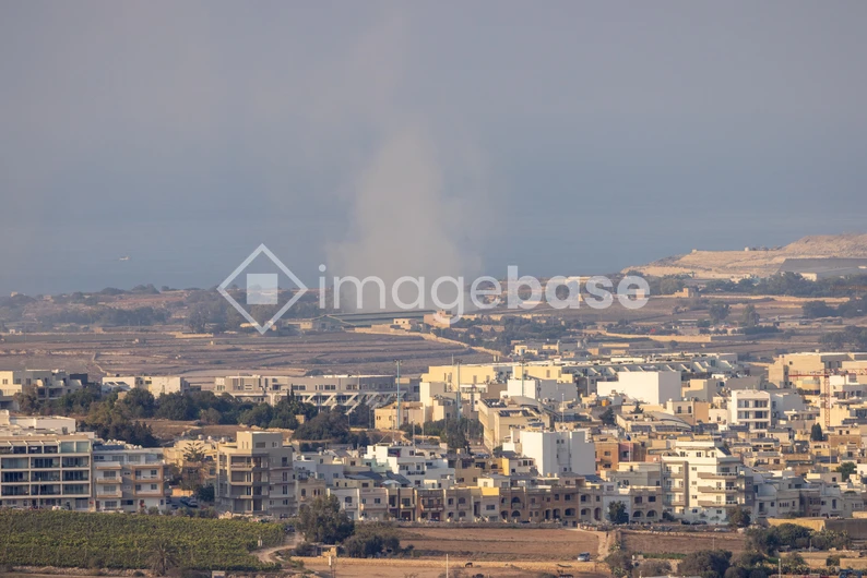 Coastal Cityscape with Smoke