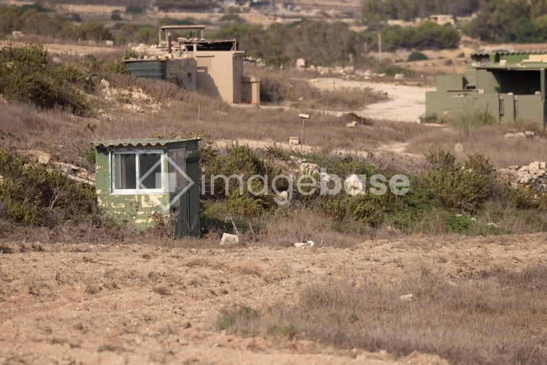 Desolate Landscape with Abandoned Structures