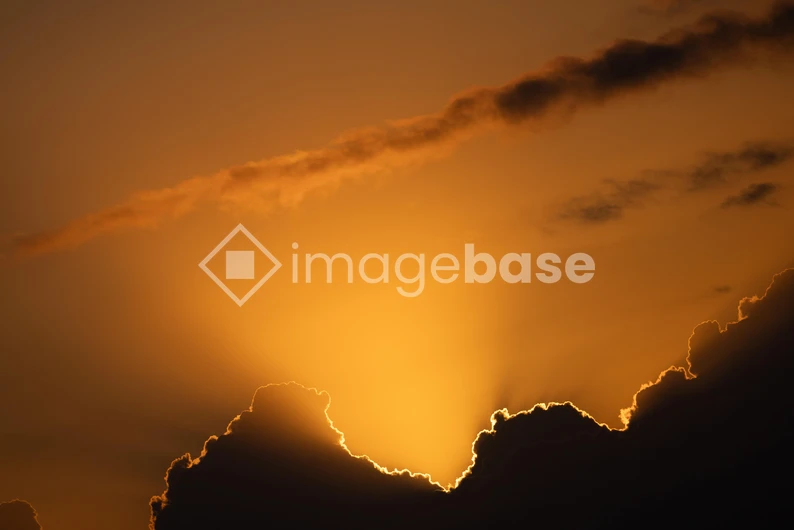 Sunset Behind Clouds