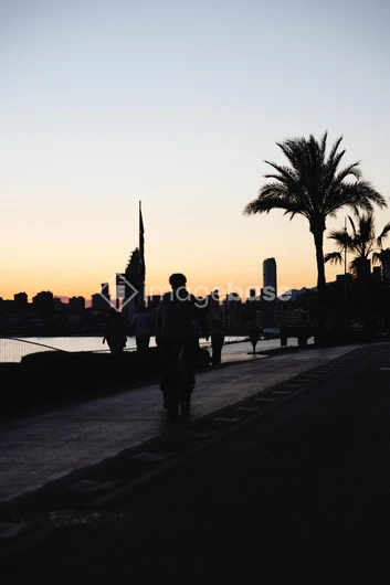 Sunset Cityscape with Cyclist