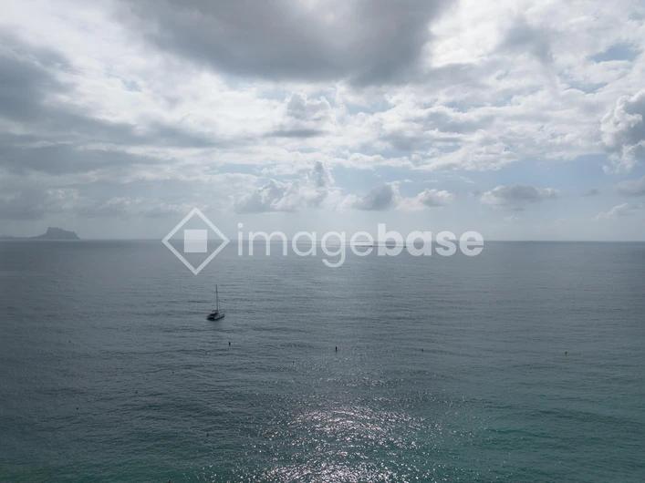 Tranquil Seascape with Sailboat