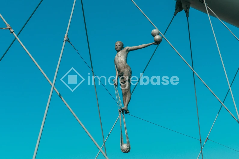 Sculpture of a Man on Tension Wires