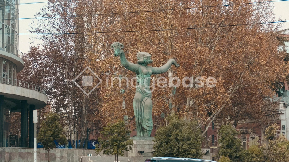 Statue in Autumn Urban Setting