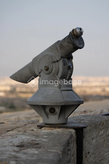 Vintage Telescope on Stone Ledge