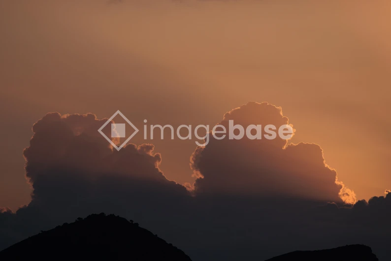 Sunset Behind Clouds
