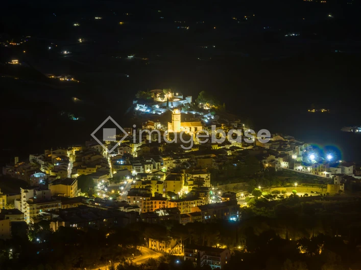 Illuminated Hilltop Town at Night