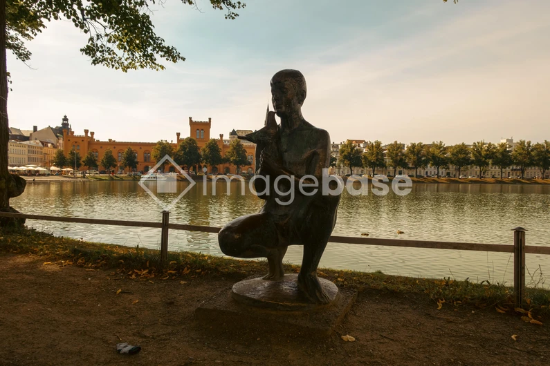 Tranquil Riverside Statue