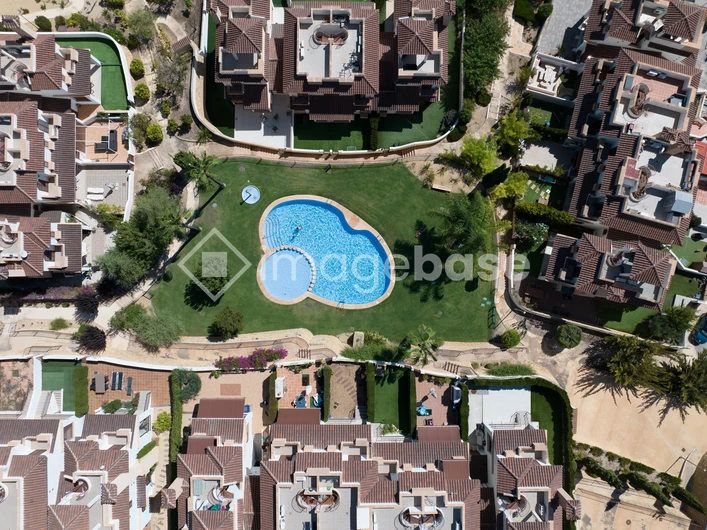Aerial View of Residential Complex with Pool