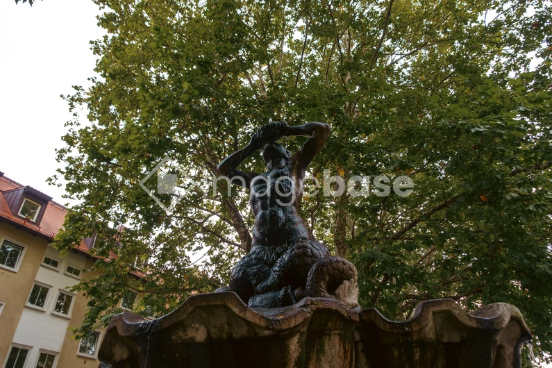 Statue in a Tree-lined Square