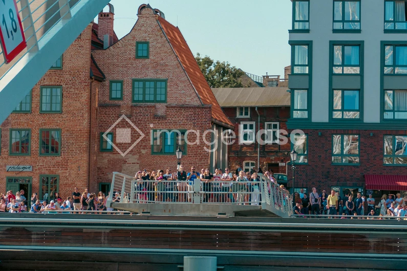 Crowded Bridge Overlooking Historic Buildings