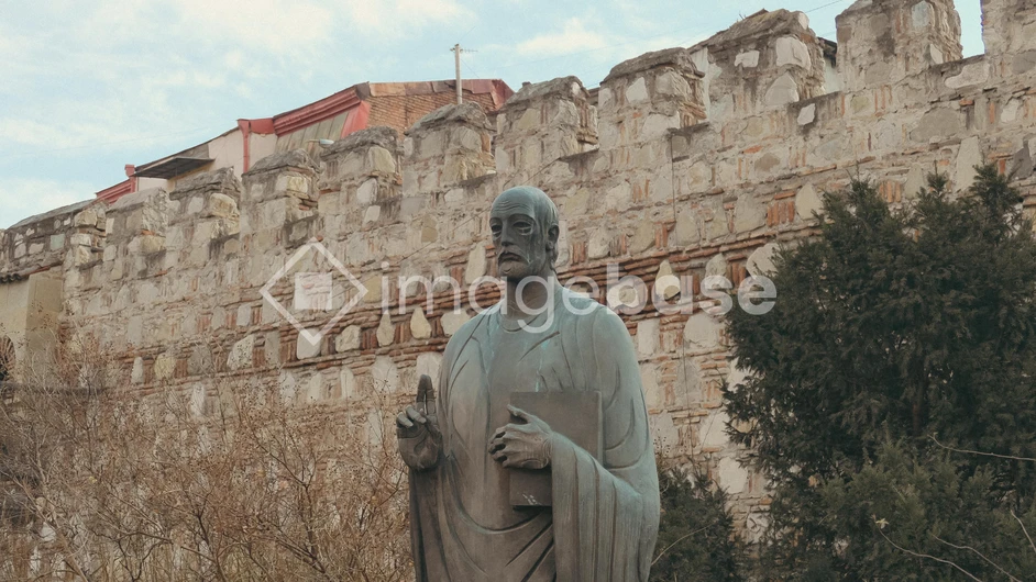 Historic Statue by Ancient Fortress