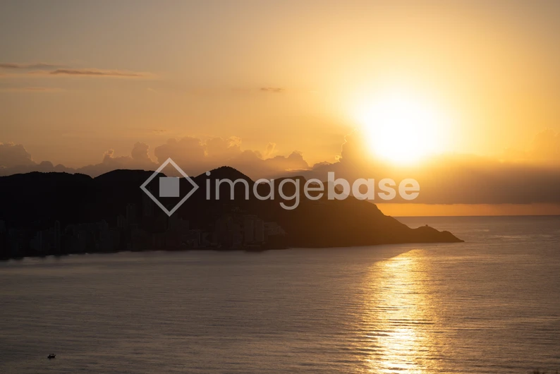 Sunset Over Coastal Cityscape