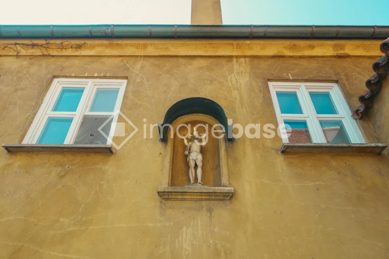 Old Building Facade with Statue