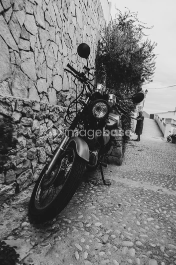 Vintage Motorcycle on Cobblestone Street