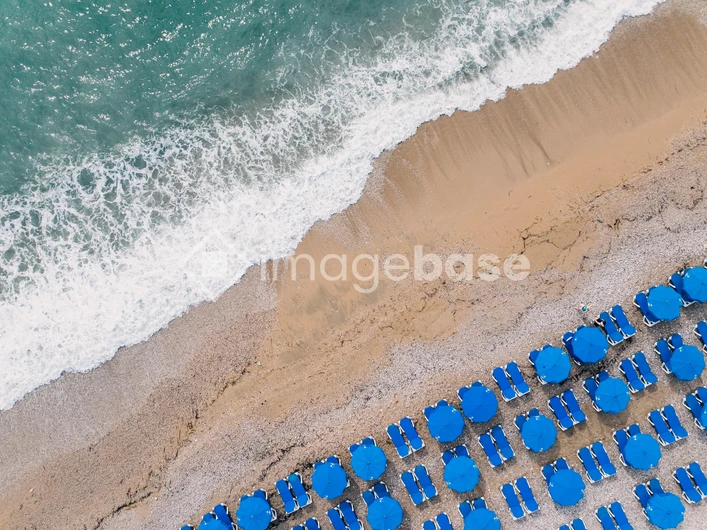Aerial View of Beach Umbrellas by the Shore