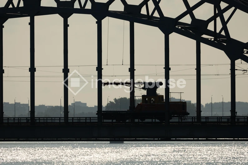 Silhouette of a Train on a Bridge