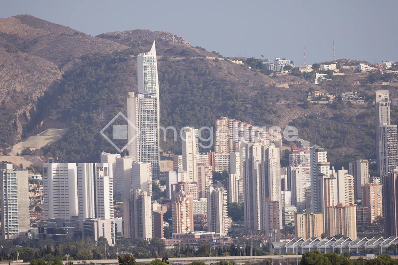 Modern Cityscape Against Mountain