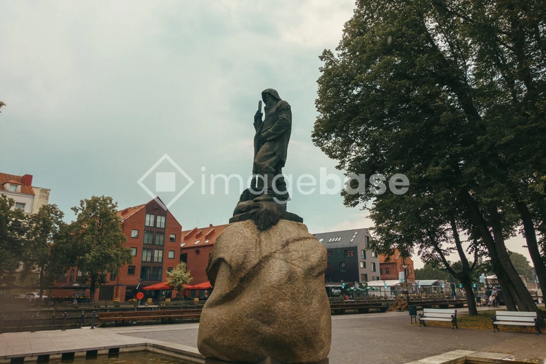 Historic Statue Amidst Urban Landscape
