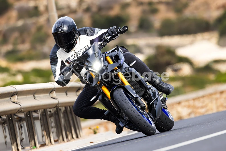 Motorcyclist on Curved Road