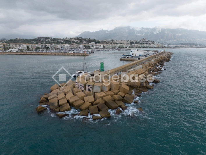 Seaside Breakwater with Cloudy Skies