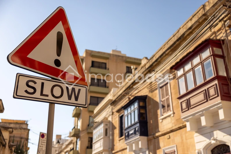 Urban Street with Slow Sign