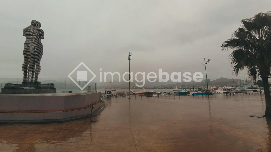 Rainy Promenade with Sculpture