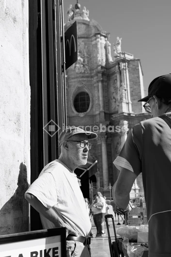 Street Encounter by Historical Building
