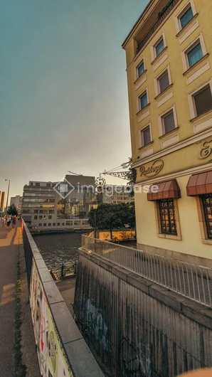 Riverside Cityscape at Sunset