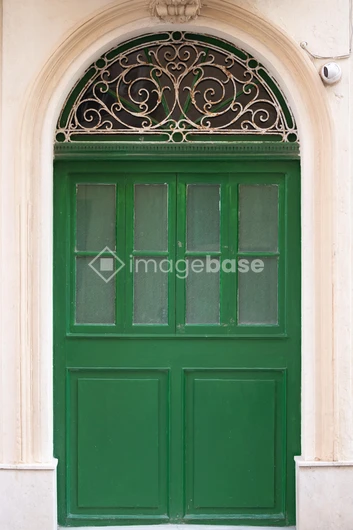 Elegant Green Door with Ornate Details