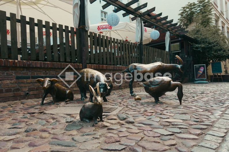 Animal Sculptures on Cobblestone Street