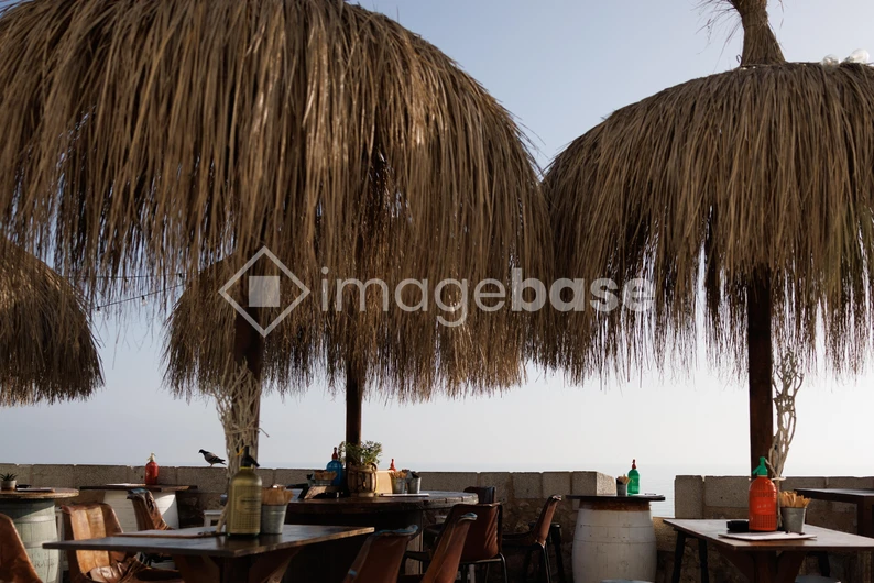 Beachside Cafe with Straw Umbrellas