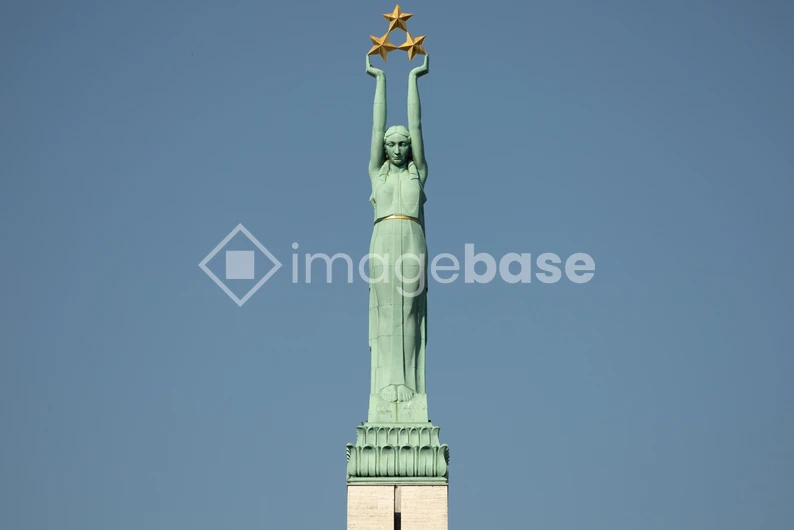 Statue with Stars against Blue Sky