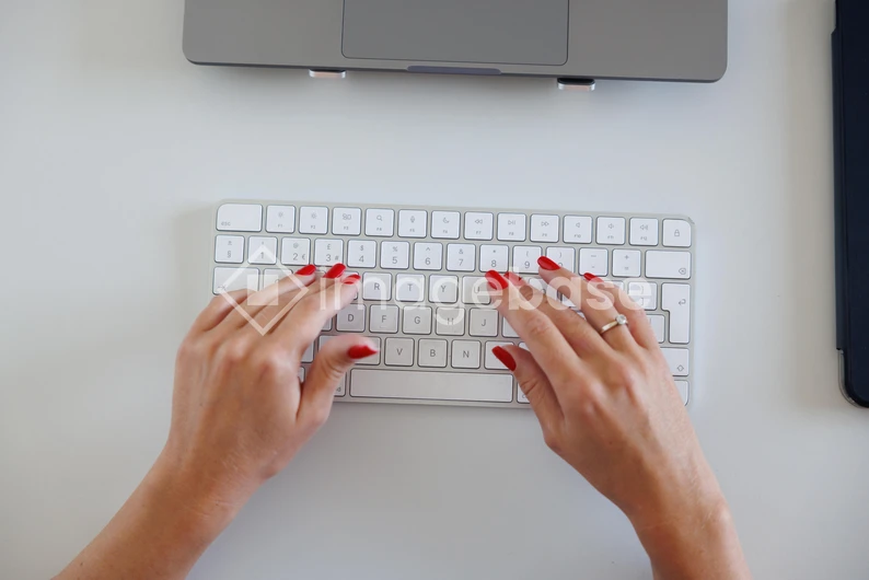 Hands Typing on Keyboard