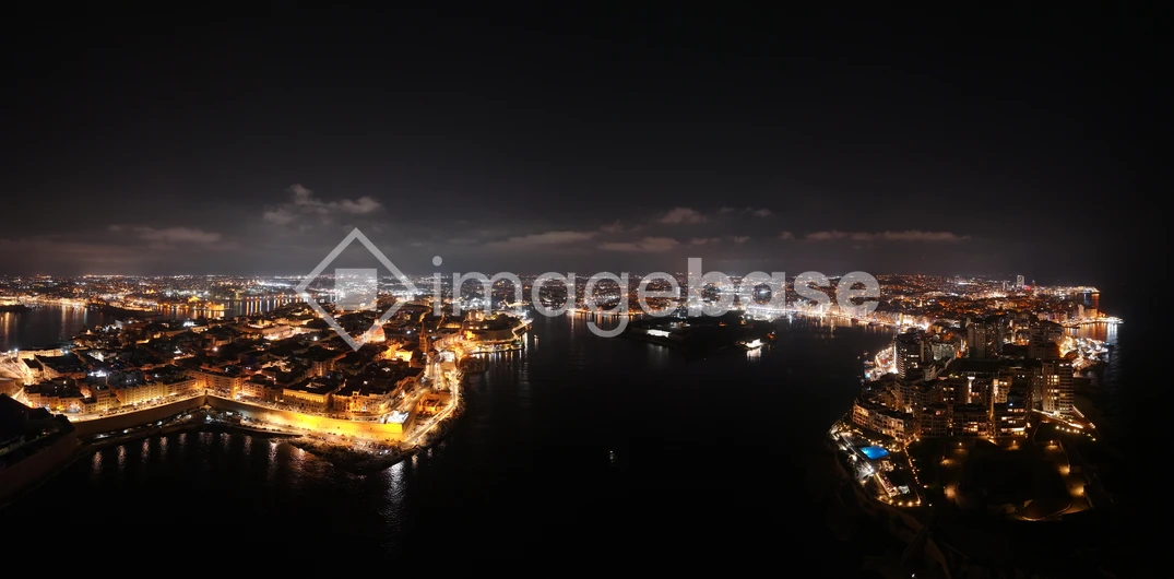 Illuminated Coastal Cityscape at Night