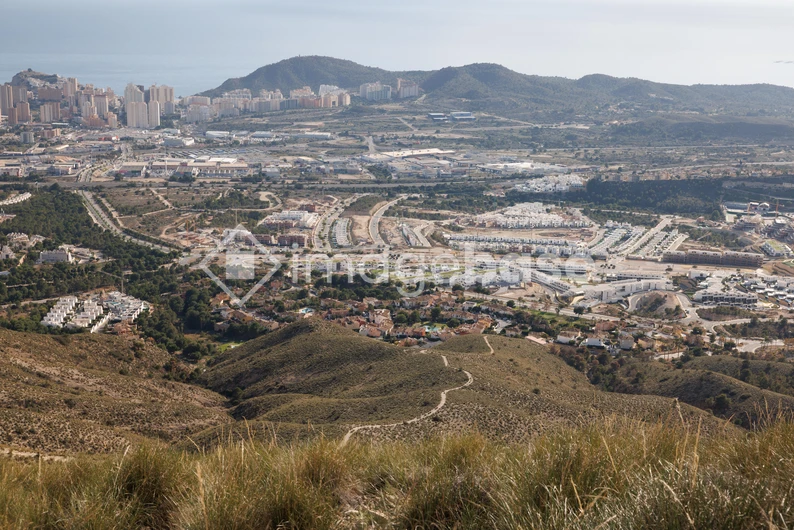 Scenic View of City and Mountains