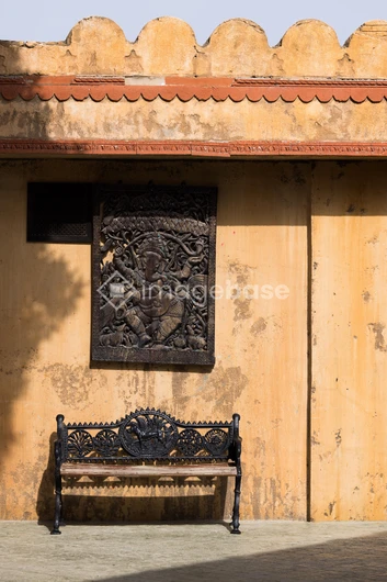 Rustic Wall with Iron Bench