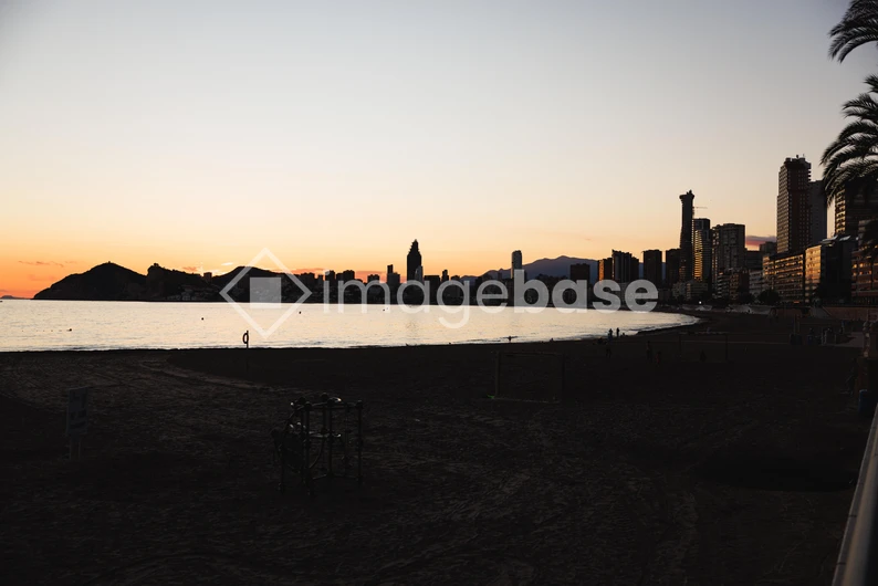 Sunset Over Coastal City Skyline