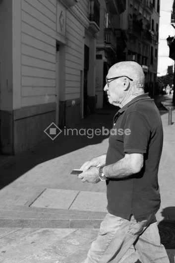 Man Strolling Along City Street
