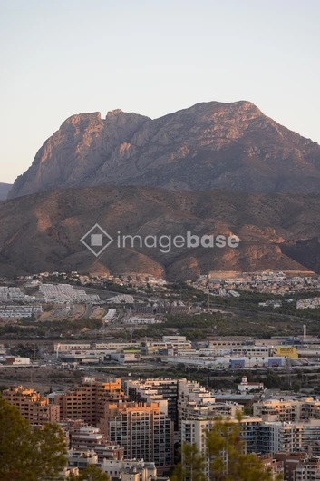 Sunlit Mountain and Cityscape