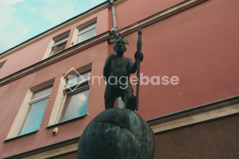 Statue against Architecture