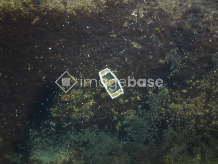 Sunken Boat in Shallow Waters
