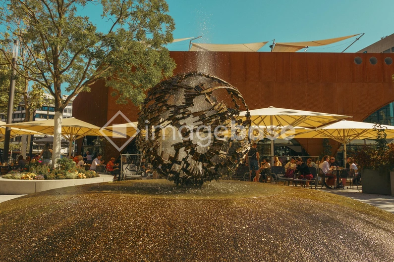 Outdoor Cafe with Artistic Fountain